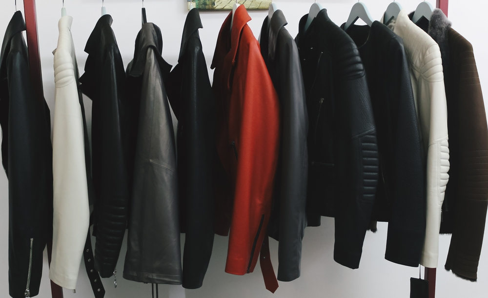 Using a padded hanger to keep the shape of second-hand leather jackets